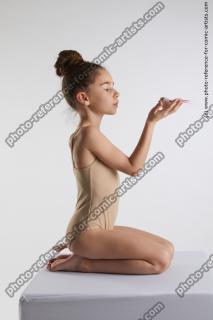 kneeling little girl with bird doroteya 06