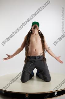 kneeling man with dreadlocks nigel 01