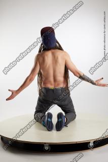 kneeling man with dreadlocks nigel 05
