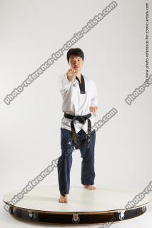 asian man taekwondo poses lan 01b