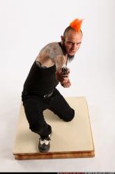 Edgar Kneeling Revolver Shooting