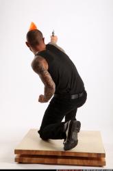 Edgar Kneeling Revolver Shooting