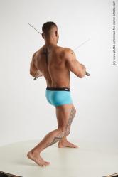 Garrott_Fighting_With_Swords