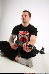 Alex Sitting With Ak-47 Rifle