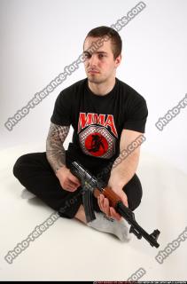 Alex Sitting With Ak-47 Rifle