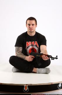Alex Sitting With Ak-47 Rifle