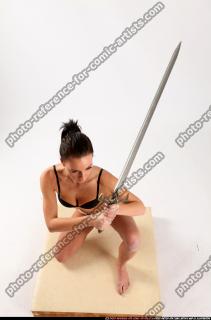 Peggy Kneeling Sword Pose