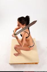 Peggy Kneeling Sword Pose