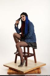 Dolores Sitting Pistol Pose