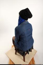 Dolores Sitting Pistol Pose