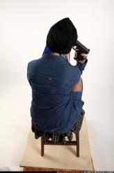 Dolores Sitting Pistol Pose