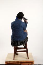 Dolores Sitting Pistol Pose