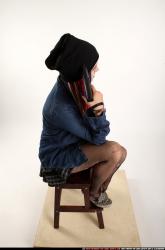 Dolores Sitting Pistol Pose