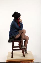 Dolores Sitting Pistol Pose