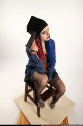 Dolores Sitting Pistol Pose