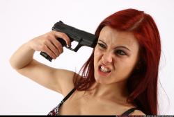 Nina Sitting Pistol Pose